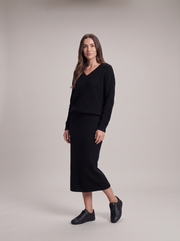 Women's knitted set with loose jumper and long straight skirt