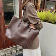 Women's large faux leather tote bag with zip and buckle
