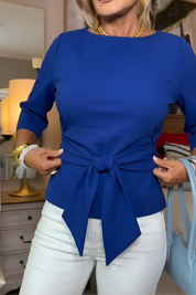 Top dames met strikdetail in de taille en 3/4 mouw