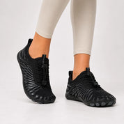 black women's sporty barefoot walking shoes with air-cushioned soles and laces