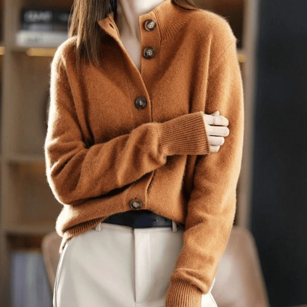 An orange-brown knitted cardigan with a collar and front buttons