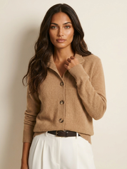 A beige women's knitted cardigan with a collar and buttons