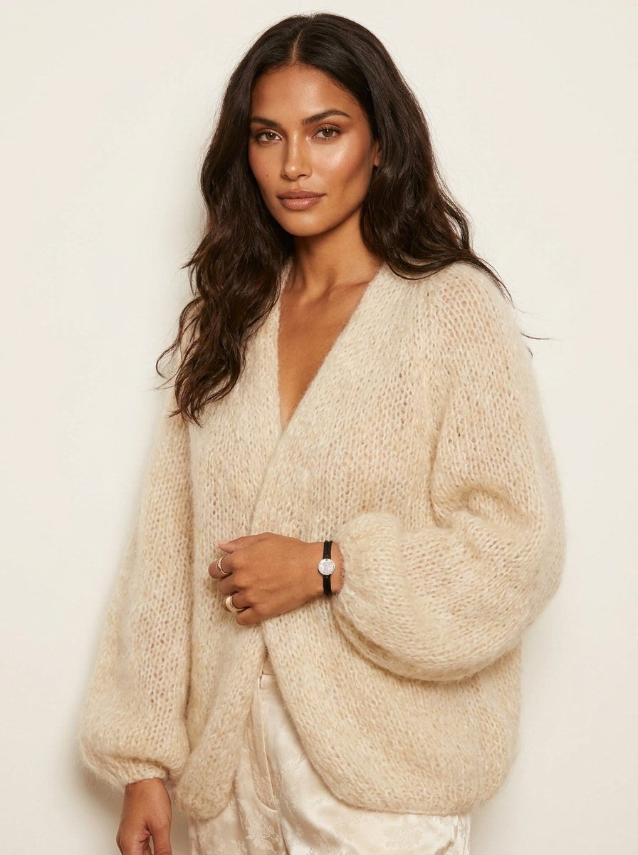 A loose-fitting women's knitted cardigan with a V-neck, wide collar and wide long sleeves