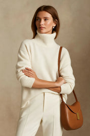 A straight-cut ecru women's knitted roll-neck jumper with long sleeves
