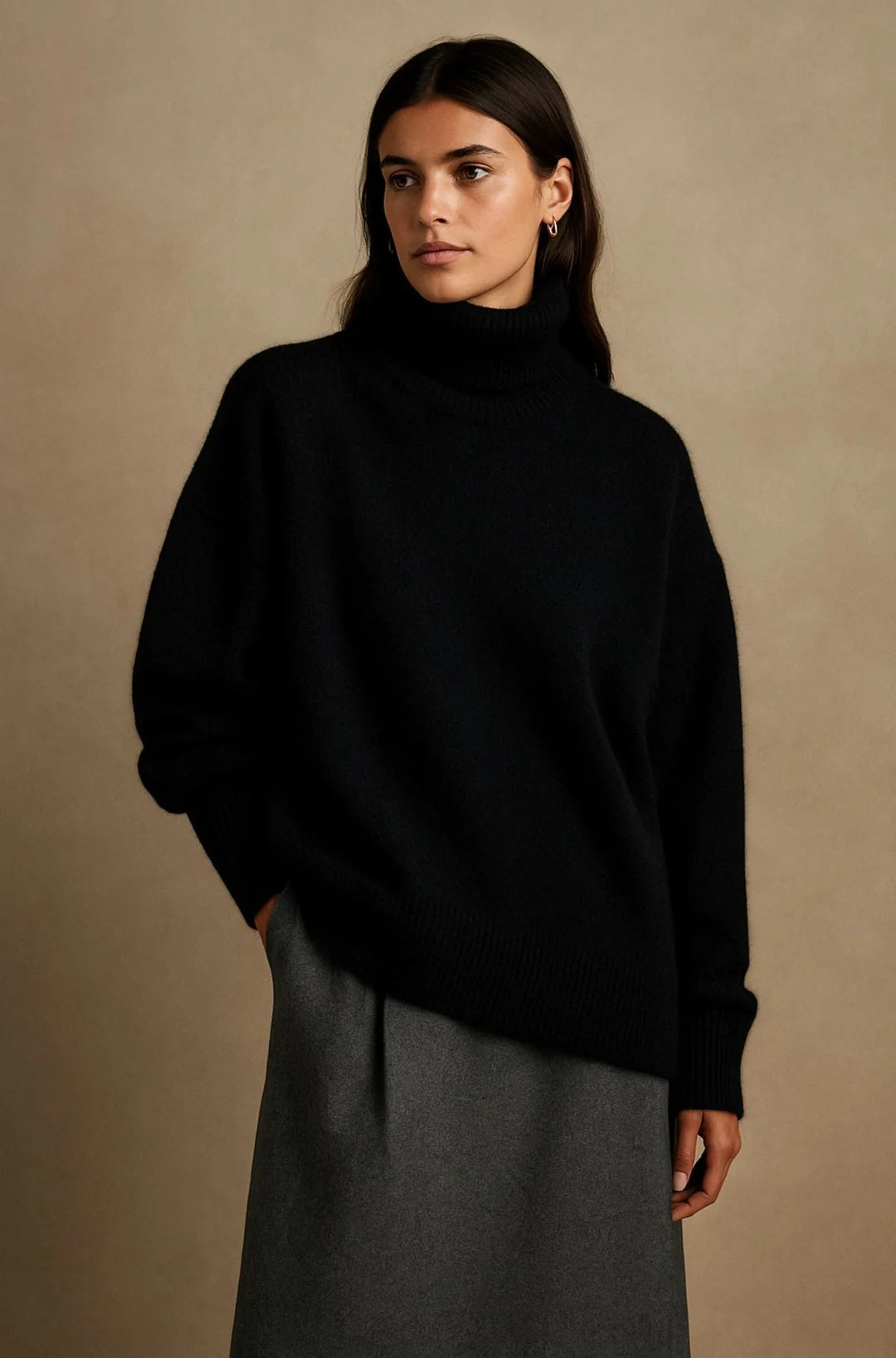 A black women's knitted roll-neck jumper with long sleeves