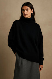 A black women's knitted roll-neck jumper with long sleeves