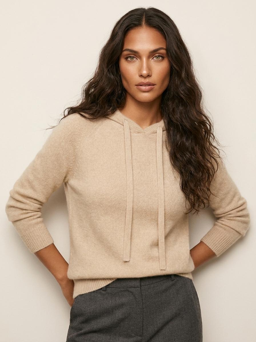 A beige women's knitted hoodie with a drawstring hood and ribbed trims