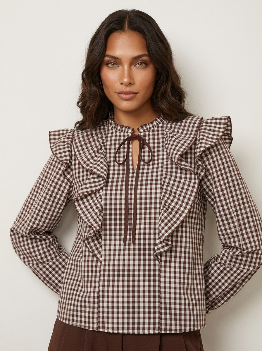 Geruite blouse met ruches en striksluiting voor, lange pofmouwen met manchetten.