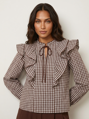 Geruite blouse met ruches en striksluiting voor, lange pofmouwen met manchetten.