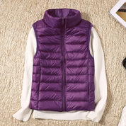 A purple padded women's gilet with a high collar and front zip.
