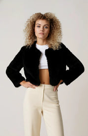 A cropped black women's furry jacket with an open front and long sleeves