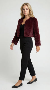 A cropped burgundy furry jacket with an open front and long sleeves