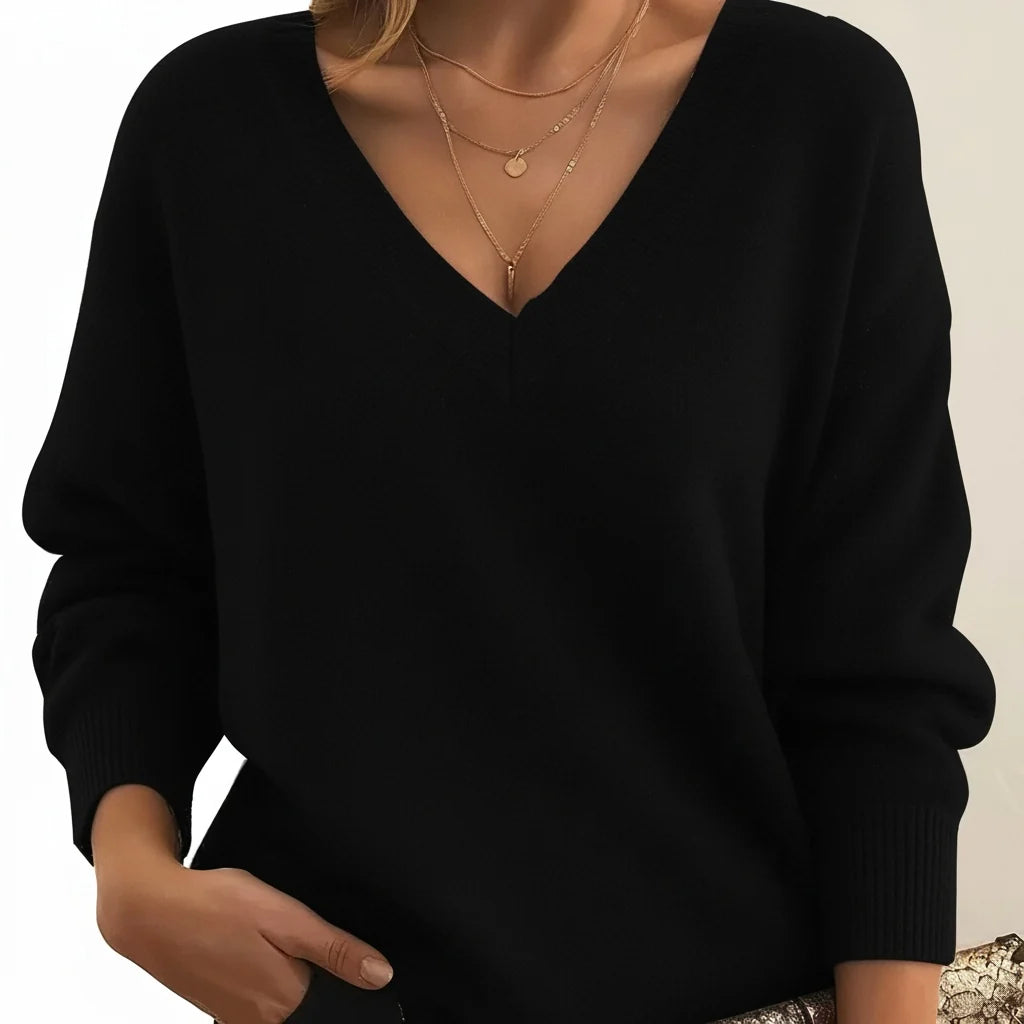 A black women's knitted V-neck jumper with long sleeves and a ribbed hem