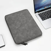 A leather laptop sleeve with a water-resistant finish for a tablet or computer