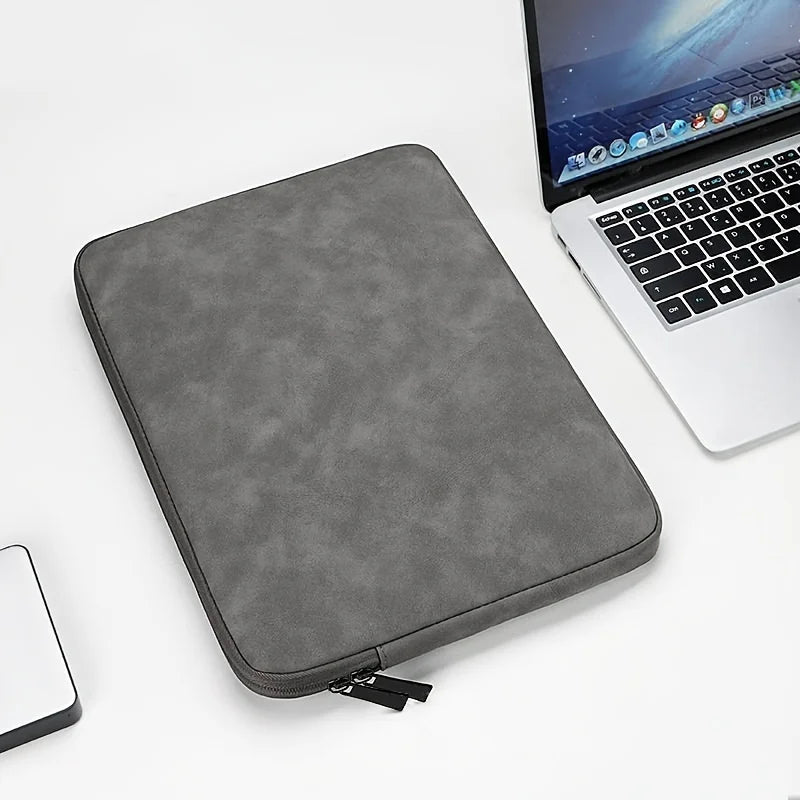 A leather laptop sleeve with a water-resistant finish for a tablet or computer