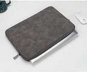 A leather laptop sleeve with a water-resistant finish for a tablet or computer
