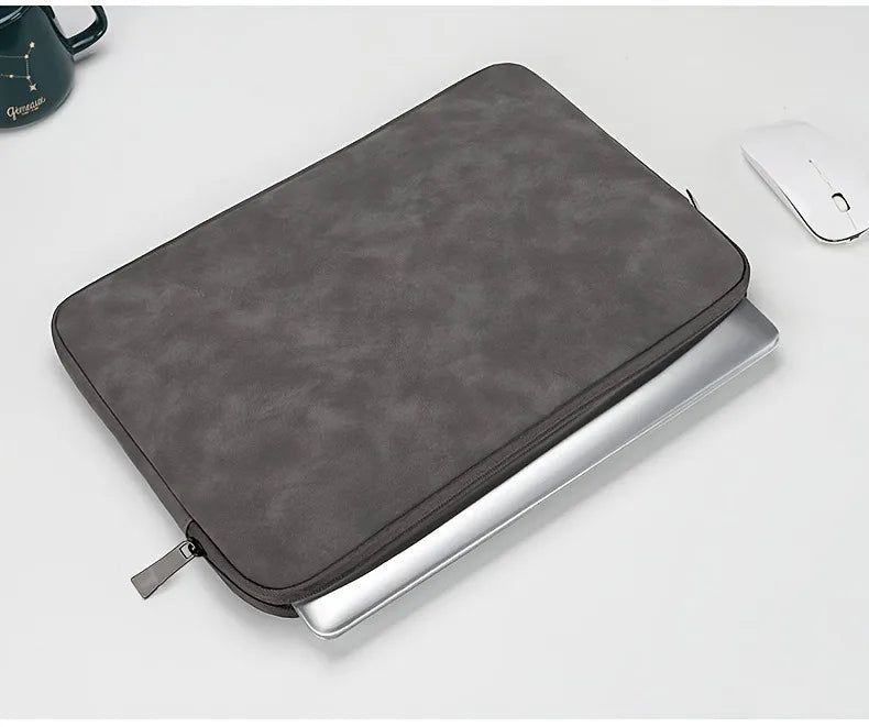 A leather laptop sleeve with a water-resistant finish for a tablet or computer