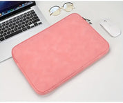 A leather laptop sleeve with a water-resistant finish for a tablet or computer