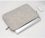 A leather laptop sleeve with a water-resistant finish for a tablet or computer