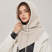 A women's knitted balaclava with a hood and drawstring