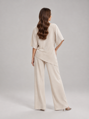 Tweedelige set dames met gedrapeerde top en wijde broek