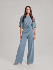 Tweedelige set dames met gedrapeerde top en wijde broek