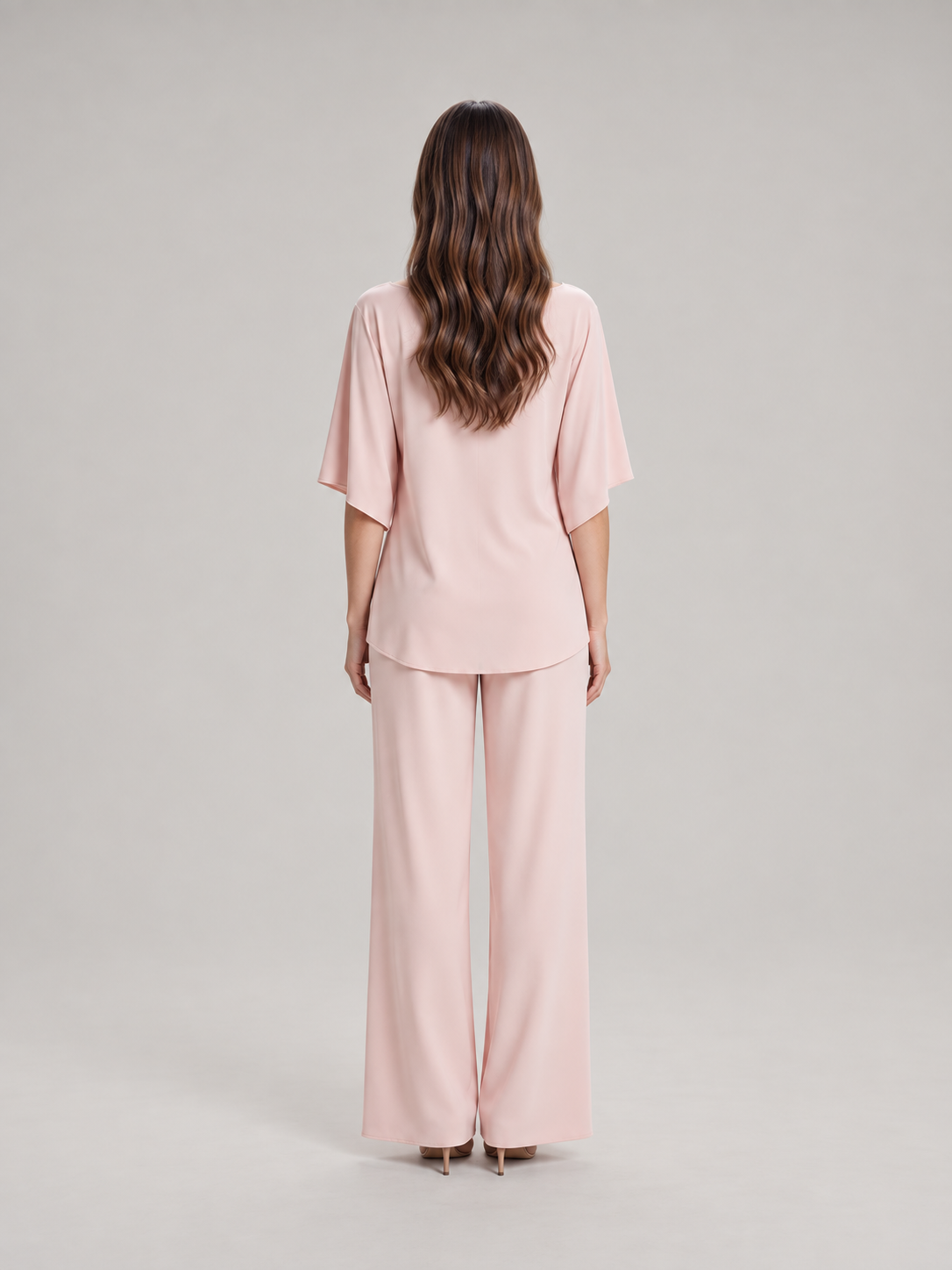 Tweedelige set dames met gedrapeerde top en wijde broek
