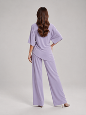 Tweedelige set dames met gedrapeerde top en wijde broek