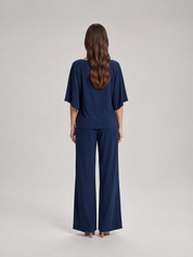 Tweedelige set dames met gedrapeerde top en wijde broek