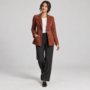 Women's brown fitted blazer with lining and pockets, worn by a female model in a walking pose