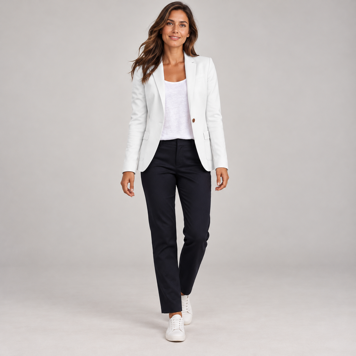 Women's fitted blazer with one button and a deep V-neck, worn by a female model, front view