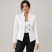 Women's open-front blazer with a textured finish and stand-up collar, worn by a female model, close-up