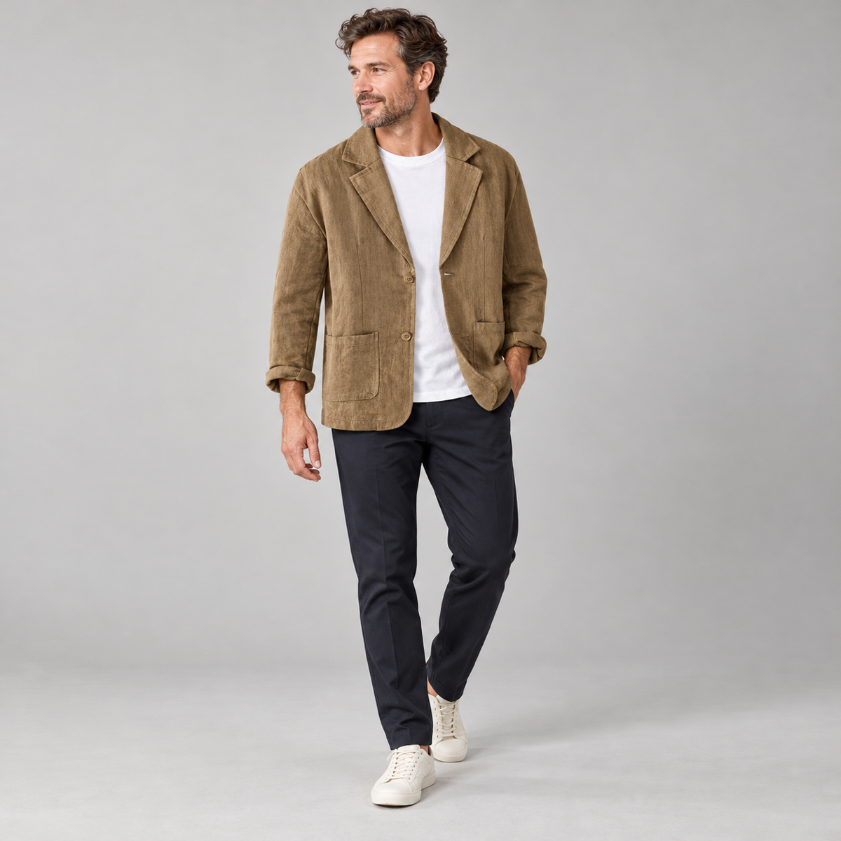 Men's casual blazer with wide lapels and pockets, worn by a male model, angled front view