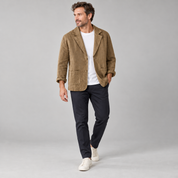 Men's casual blazer with wide lapels and pockets, worn by a male model, angled front view