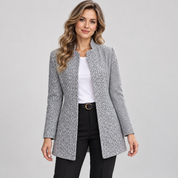 Women's long grey blazer with a stand-up collar, worn by a female model, close-up