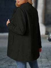 Long women’s collarless open-front blazer