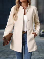 Long women’s collarless open-front blazer