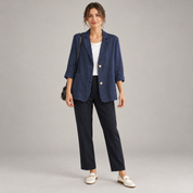 Women's loose-fit blazer with two buttons and roll-up sleeves, worn by a female model, front view