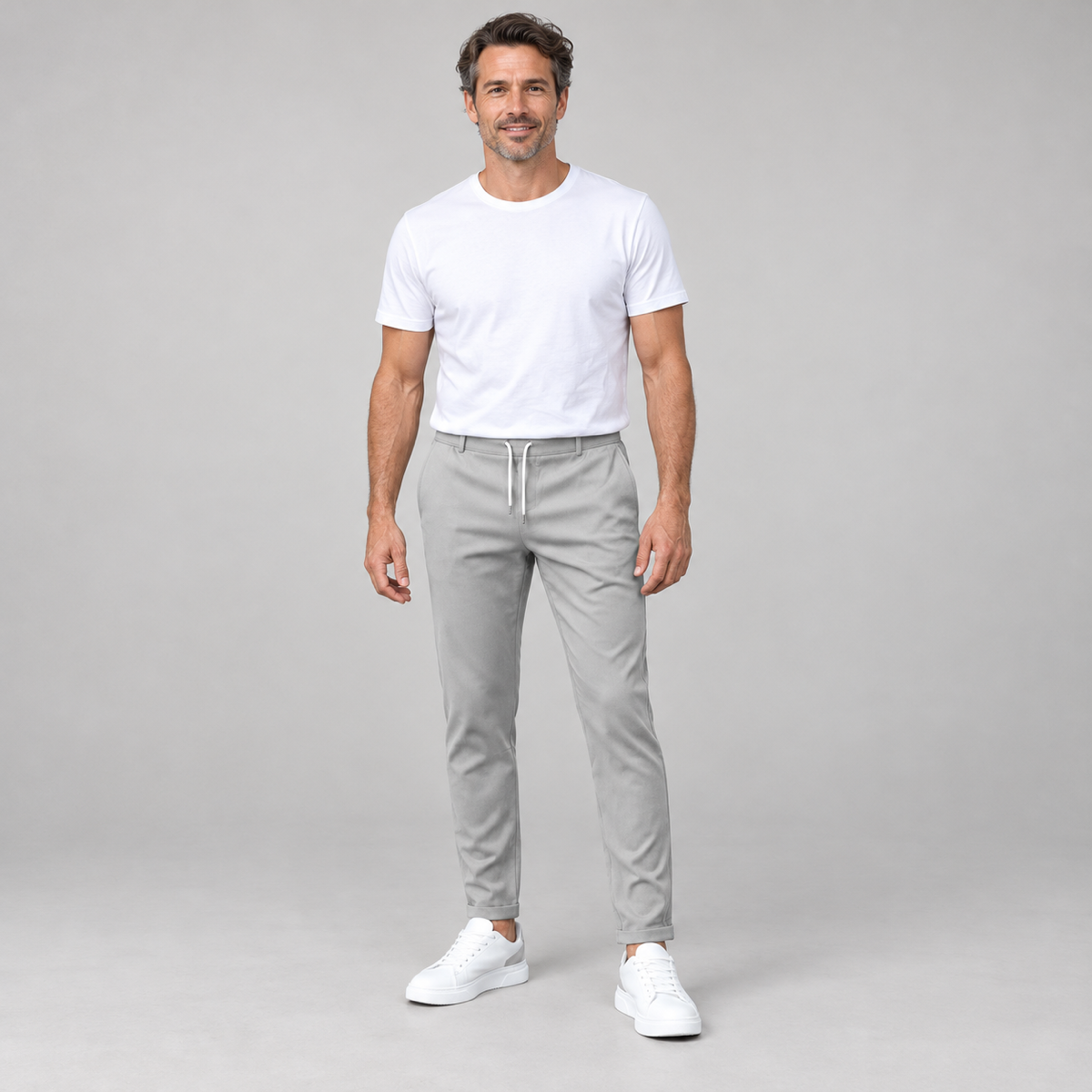Men's classic tailored trousers with a neat fit, worn by a male model, front view
