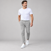 Men's classic tailored trousers with a neat fit, worn by a male model in a walking pose