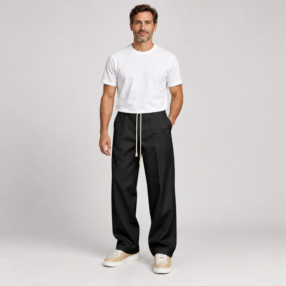 Men's trousers with a drawstring and a slim fit, worn by a male model, front view