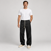 Men's trousers with a drawstring and a slim fit, worn by a male model, front view