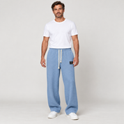 Men's wide-leg trousers with a drawstring and deep pockets, worn by a male model, front view