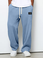 Men's wide-leg trousers with a drawstring and deep pockets