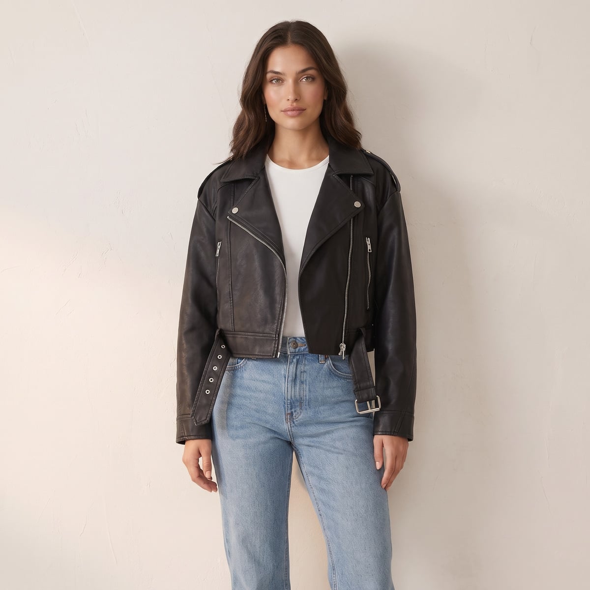 Women's cropped faux leather jacket with belt and asymmetric zip in black
