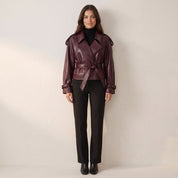 Women's faux leather jacket in burgundy with wide lapel and belt