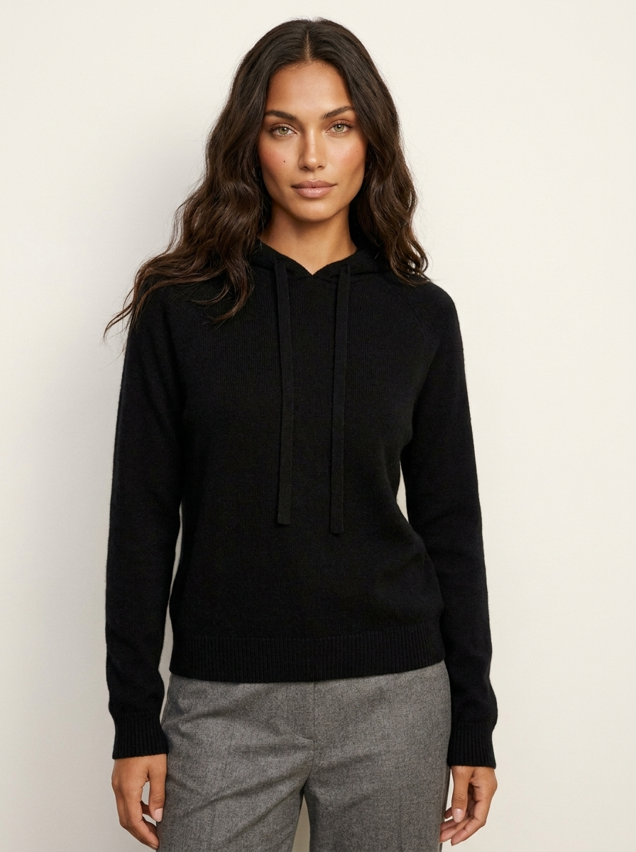 A black women's knitted hoodie with a drawstring hood and ribbed trims