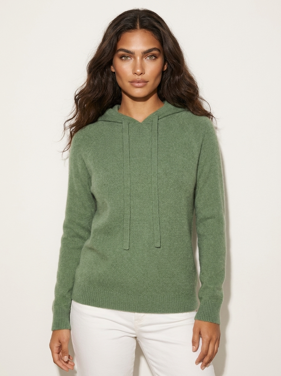 A green women's knitted hoodie with a drawstring hood.