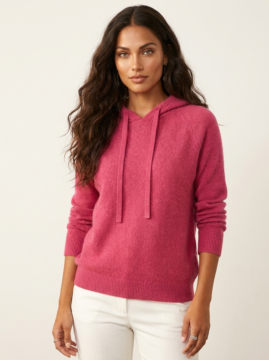 A pink women's knitted hoodie with a drawstring hood, mélange texture and long sleeves
