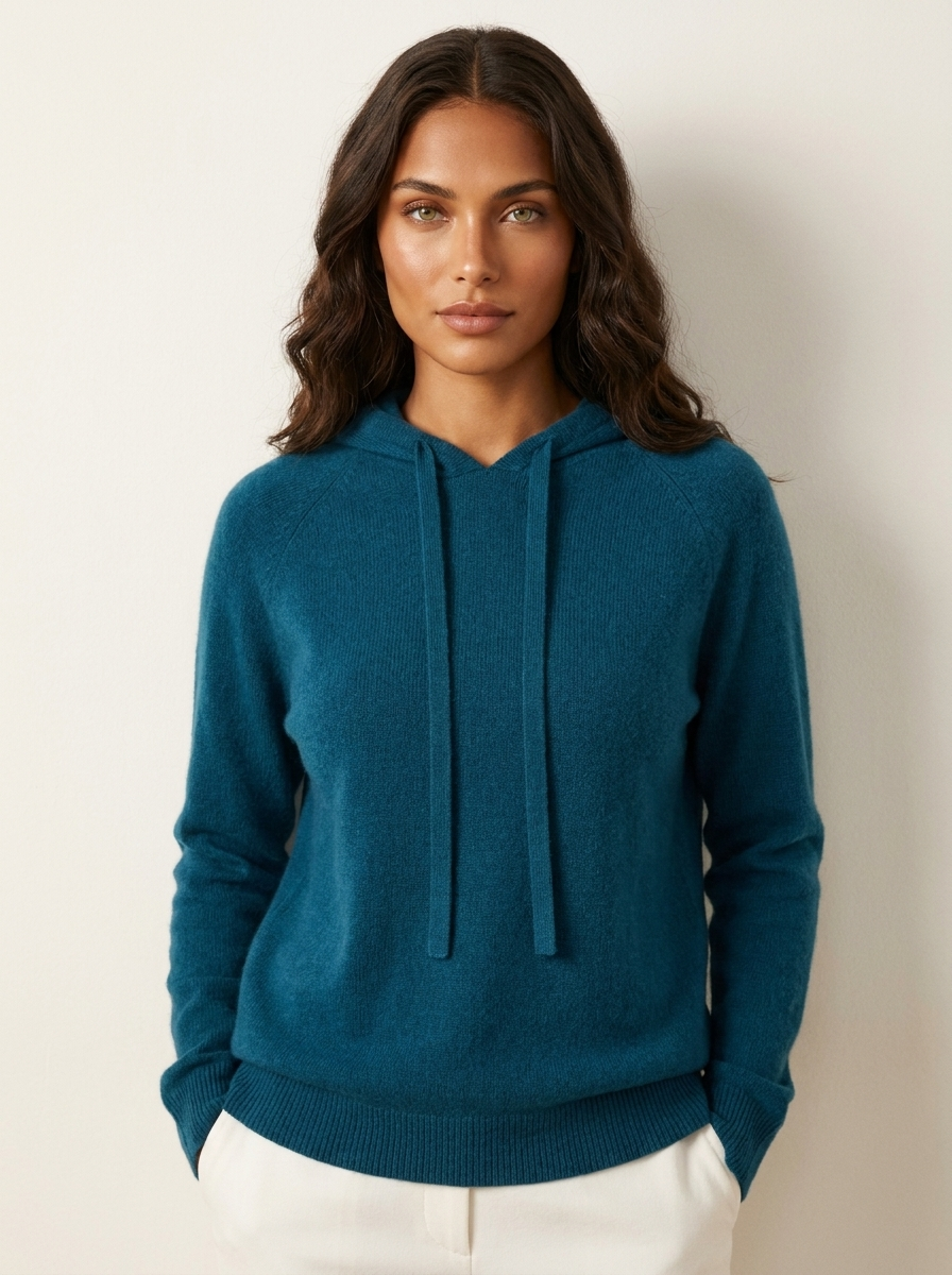 A blue women's knitted hoodie with a drawstring hood and long sleeves